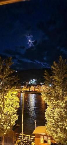 a view of a body of water at night at Apartment Mademoiselle in Višegrad