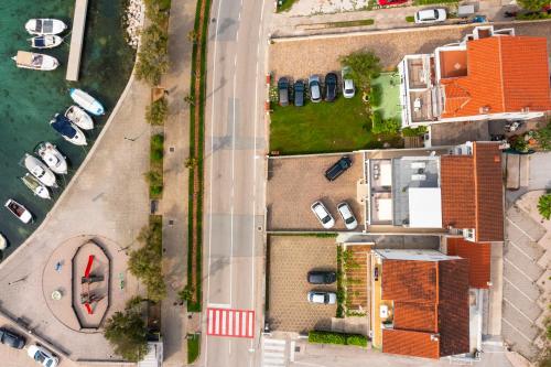 an overhead view of a parking lot with parked cars at Apartment and Rooms Dalmatiko in Vodice