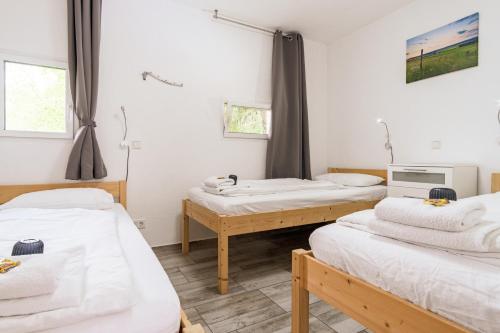 Ένα ή περισσότερα κρεβάτια σε δωμάτιο στο Eifel-Apartments Orsfeld