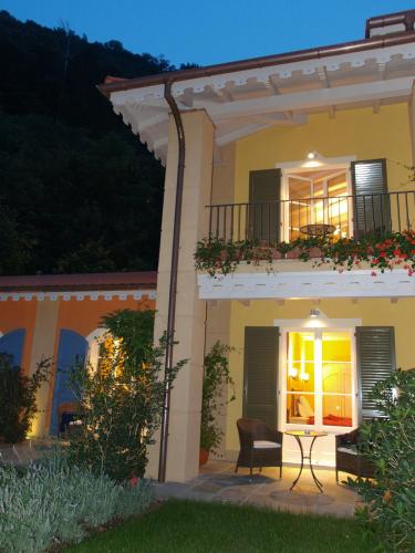 a house with a table in front of it at Park Hotel Villa Belvedere in Cannobio