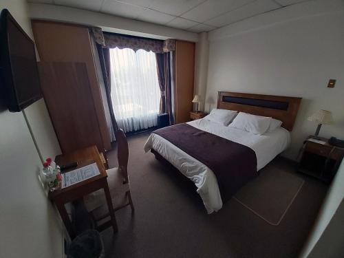 Postel nebo postele na pokoji v ubytování Hotel Esmeralda