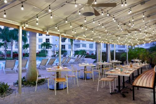 a patio with tables and chairs and lights at Meliá Orlando Celebration in Orlando