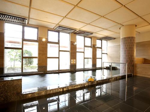 a large room with a swimming pool with windows at Blancart Misasa - Vacation STAY 14624v in Misasa
