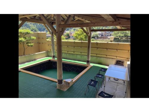 a patio with chairs and a pool with a gazebo at Blancart Misasa - Vacation STAY 14628v in Misasa