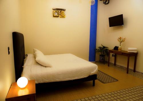 Hotel CHOLOAにあるベッド