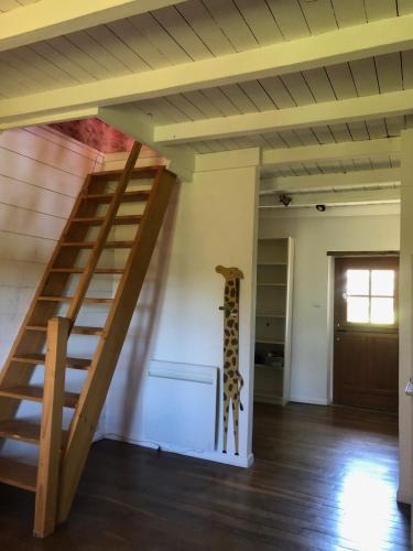 a room with a staircase in a house at Grande maison familiale, rustique et charmante en Bourgogne, dans le Morvan in Dun-sur-Grandry