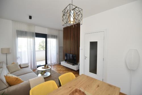 a living room with a couch and a table at Apartman Leutar in Trebinje