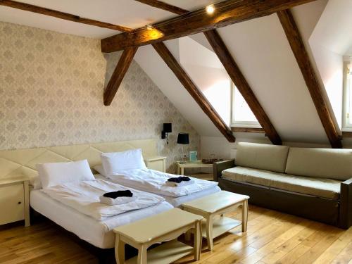 Postel nebo postele na pokoji v ubytování Dolce Vita Suites Boutique