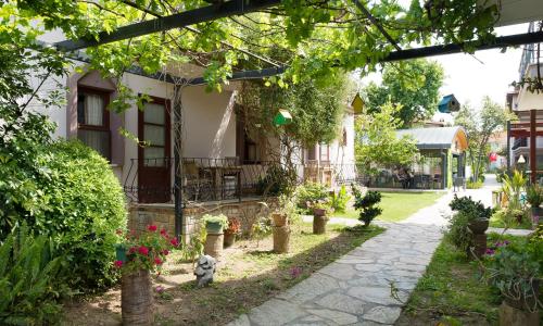 a garden in front of a house at Vira Suites Hotel in Göcek