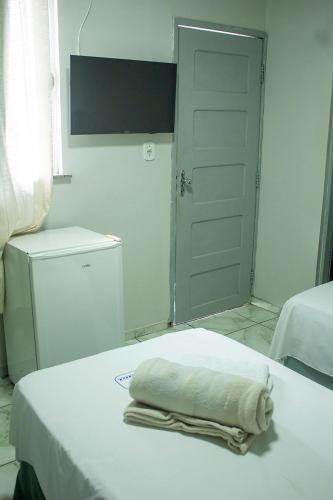 Hotel Itatiaiaにあるベッド