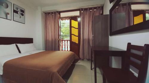 Ένα ή περισσότερα κρεβάτια σε δωμάτιο στο Tintaya Hotel Chachapoyas