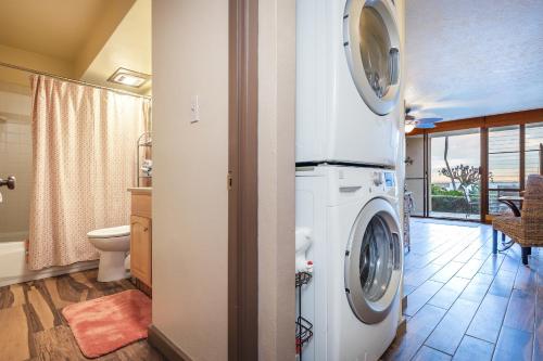 a bathroom with a washer and dryer in a house at 106 Milowai in Wailuku