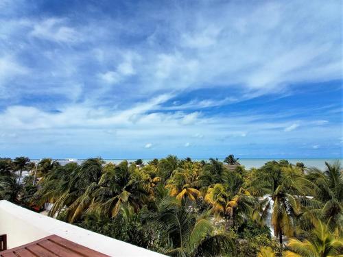 a view of the ocean from the balcony of a resort at 87972 Romantic condo, best retreat for a couple, 1 block from the Ocean in Progreso