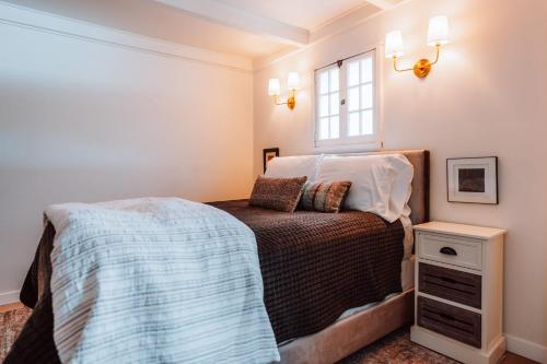 a bedroom with a bed and a window at Swank House on Main St in Ashland in Ashland