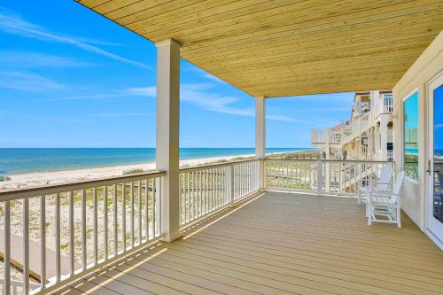 a balcony with a view of the beach at Macon Memories in St. George Island