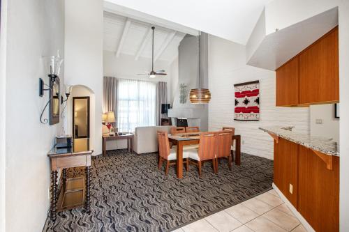 a kitchen and living room with a table and a dining room at Scottsdale Camelback Resort in Scottsdale