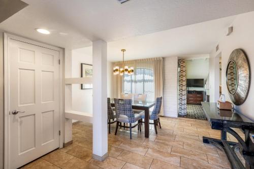 a dining room and living room with a table and chairs at Scottsdale Camelback Resort in Scottsdale