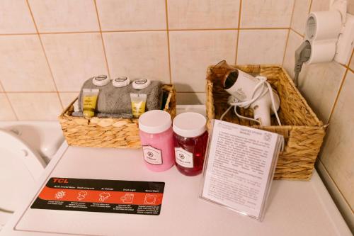 a counter with two baskets and a hair dryer at Morpheus Realm Apartment in Ioannina