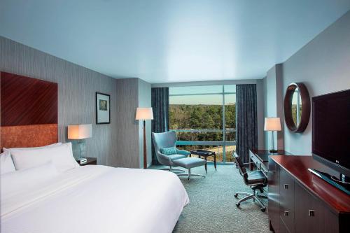 a hotel room with a bed and a television at The Westin Richmond in Richmond