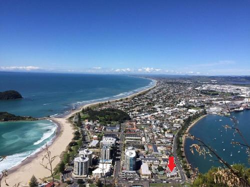 an aerial view of a beach and the ocean at The Bay The Beach The Mount The Best in Mount Maunganui