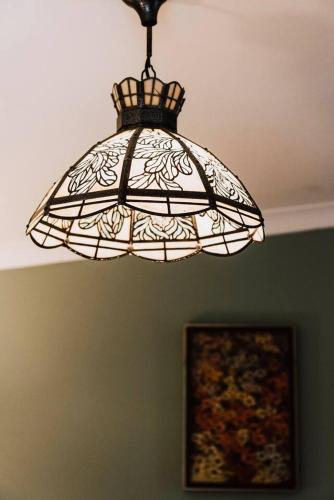 a chandelier hanging from a ceiling in a room at Black Springs - A Romantic Bushland Escape in Mudgee