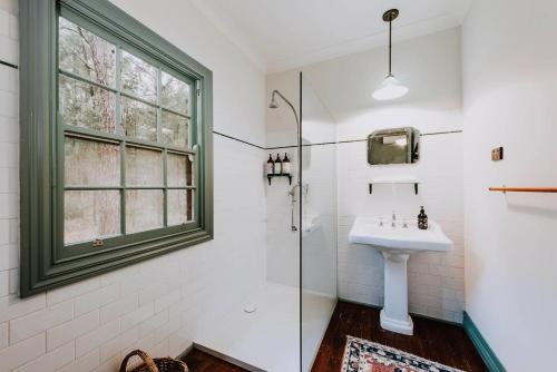 a bathroom with a sink and a shower at Black Springs - A Romantic Bushland Escape in Mudgee