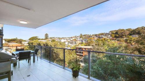 a balcony with a view of a city at Oceans Edge #19 Short Walk To Beach , Shops and Cafes Accom Holidays in Terrigal