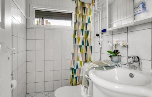 a white bathroom with a sink and a shower at Lovely Home In Slagelse With Wifi in Slagelse