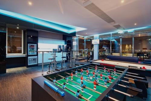 a room with a pool table and a bar at Hotel 7 Taichung in Taichung