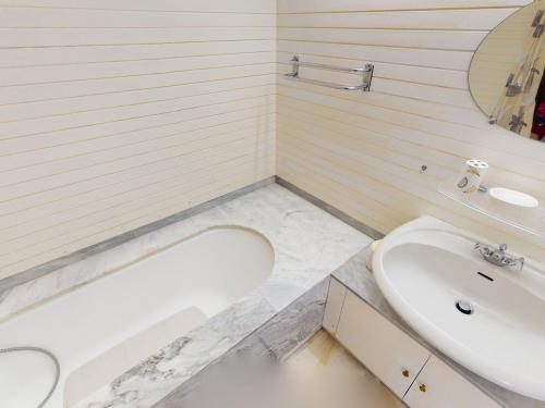 a bathroom with a sink and a toilet and a tub at Grand 3P à Menton avec terrasses et parkings - FR-1-196-331 in Menton