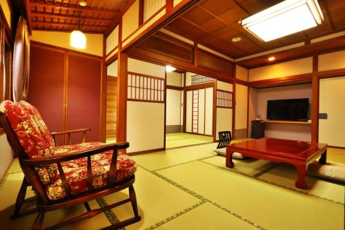TV a/nebo společenská místnost v ubytování Ryokan Tanabe 旅館田邊