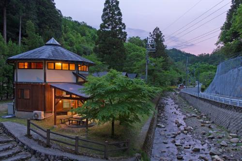 a house on the side of a train track at Hiyoshi Forest Resort Yamanoie in Nantan city