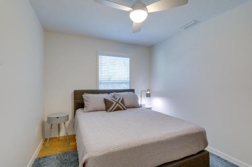 a bedroom with a bed and a ceiling fan at St Petersburg Vacation Rental 1 Mi to Downtown! in St. Petersburg
