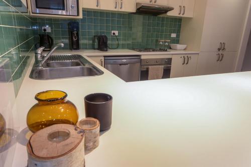 a kitchen with a sink and a counter top at Twin Towers 102a in Mount Buller