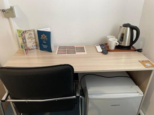 Příslušenství pro přípravu čaje a kávy v ubytování Apec Hotel