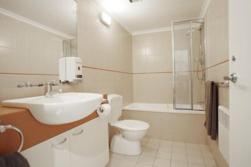 a bathroom with a sink and a toilet and a shower at Elkhorn 7 in Mount Buller