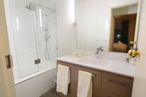 a bathroom with a sink and a shower at Molony's 12 in Mount Buller