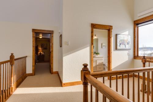 a staircase in a house with a hallway and a window at Alpine Airspace by KABINO Airpark Foosball Garage Satellite in Alpine