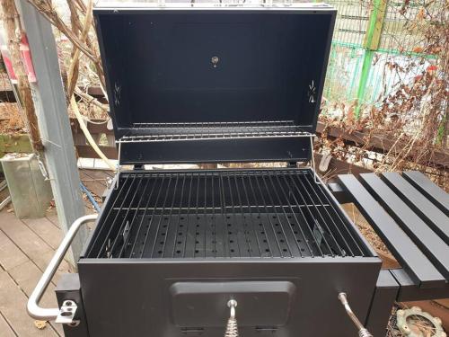 a charcoal grill sitting on top of a bench at Gugangjae Hanok Stay in Jeonju