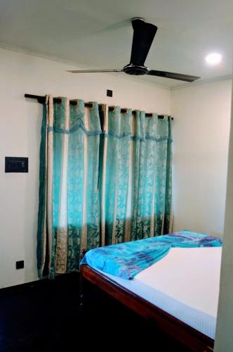 Katil atau katil-katil dalam bilik di Wallama Villa