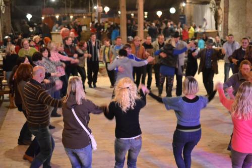 a group of people dancing on a dance floor at Penzion Dvůr Krasíkov in Kokašice
