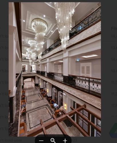 a large building with aasteryasteryasteryasteryasteryasteryasteryasteryasteryasteryastery at The Fern Shelter Resort Palghar in Manor