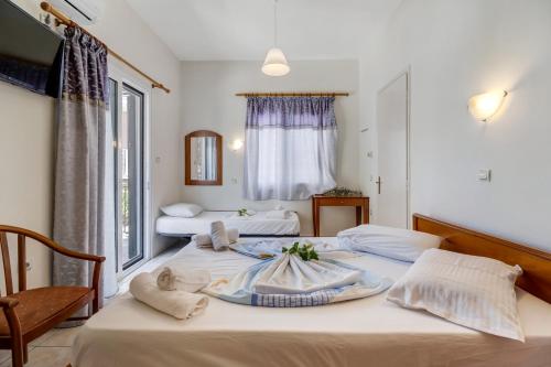 a hotel room with two beds with towels on them at Nikiana Club - Studio 6 in Nikiana