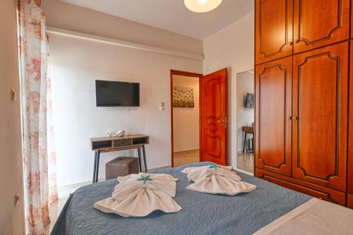 A bed or beds in a room at Armonia