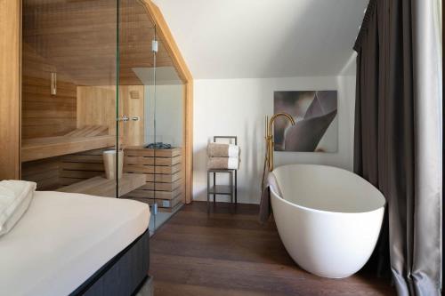Ansitz Battisti Suitesにあるベッド
