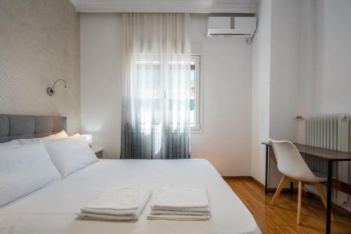 Кровать или кровати в номере “Athens Cosmos” Apartment in Neos Kosmos