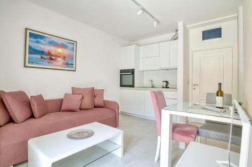 a living room with a couch and a table at The Golden Luxury Apartments in Kotor