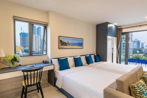 Ένα ή περισσότερα κρεβάτια σε δωμάτιο στο The Home Hotel & Apartment