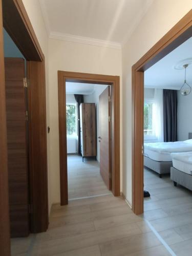 a room with a bedroom with a bed and a doorway at Clove Boutique House Apart in Akcaabat