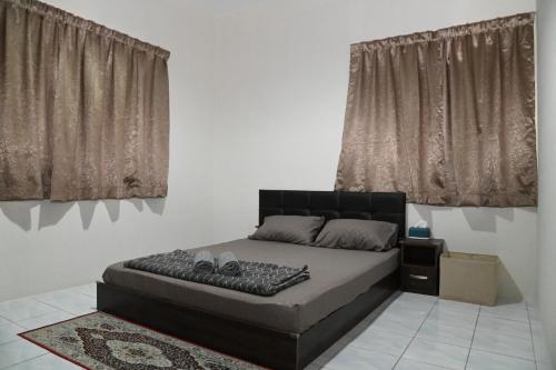 Postel nebo postele na pokoji v ubytování KRPV Homestay